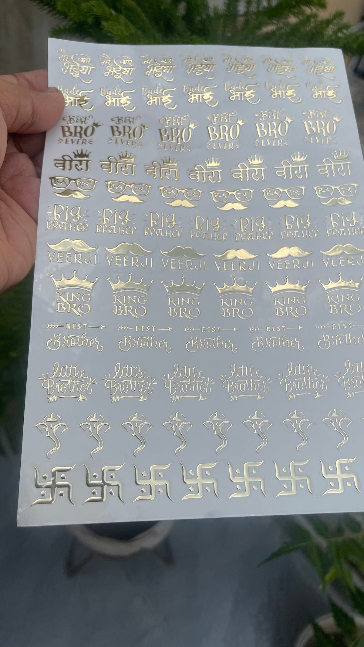 Golden Embossed Rakhi Resin Stickers styled flat lay
